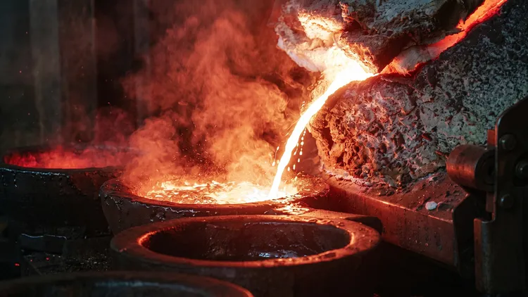 Molten bronze alloy being poured into cymbal molds